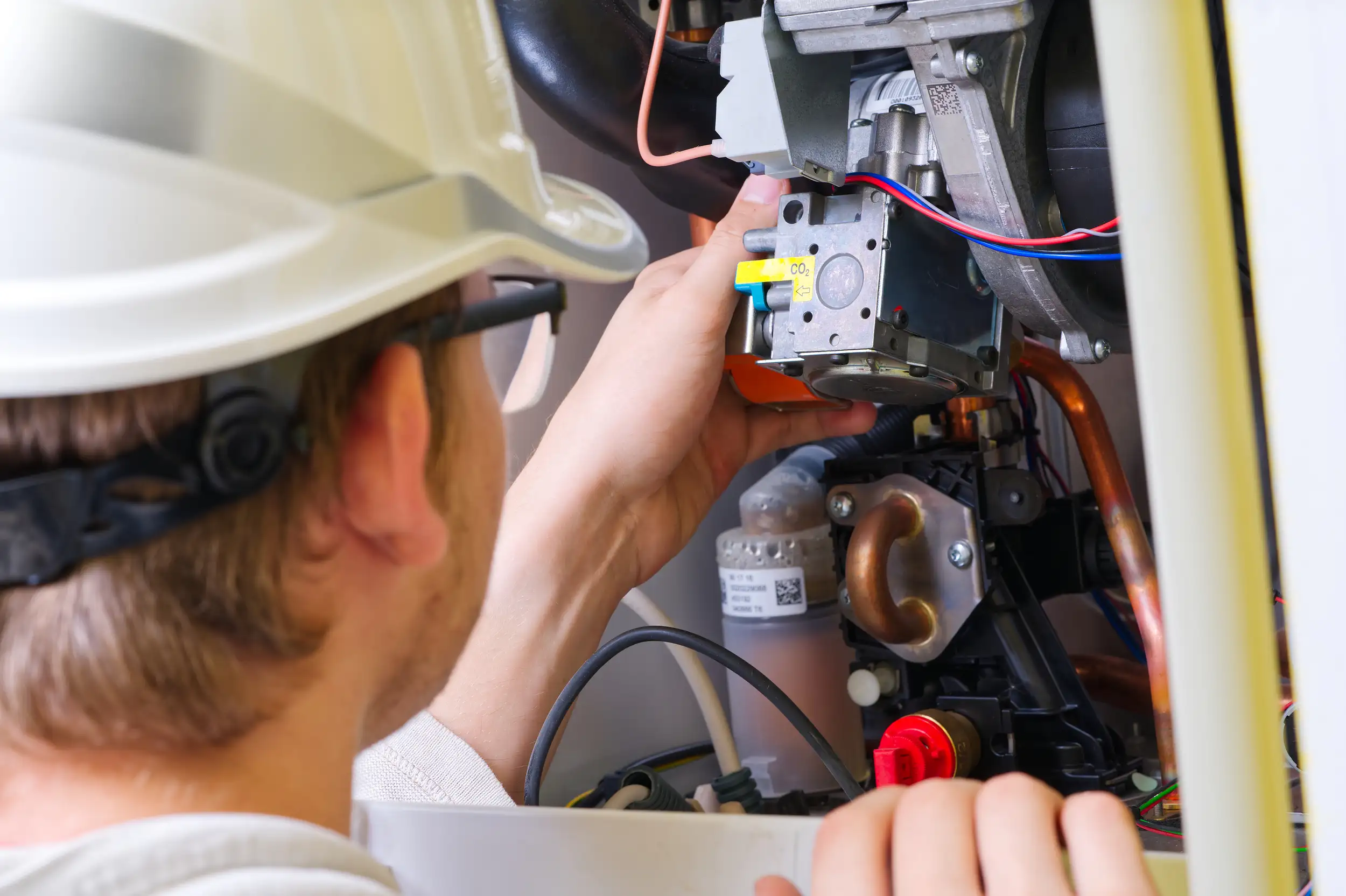 man checking the mechanical components