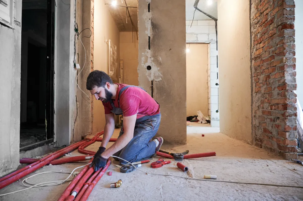 a man with beard fixing the cables