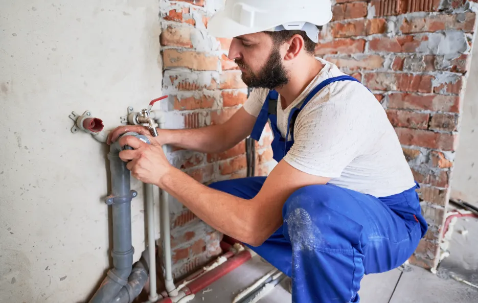 man installing the pipe